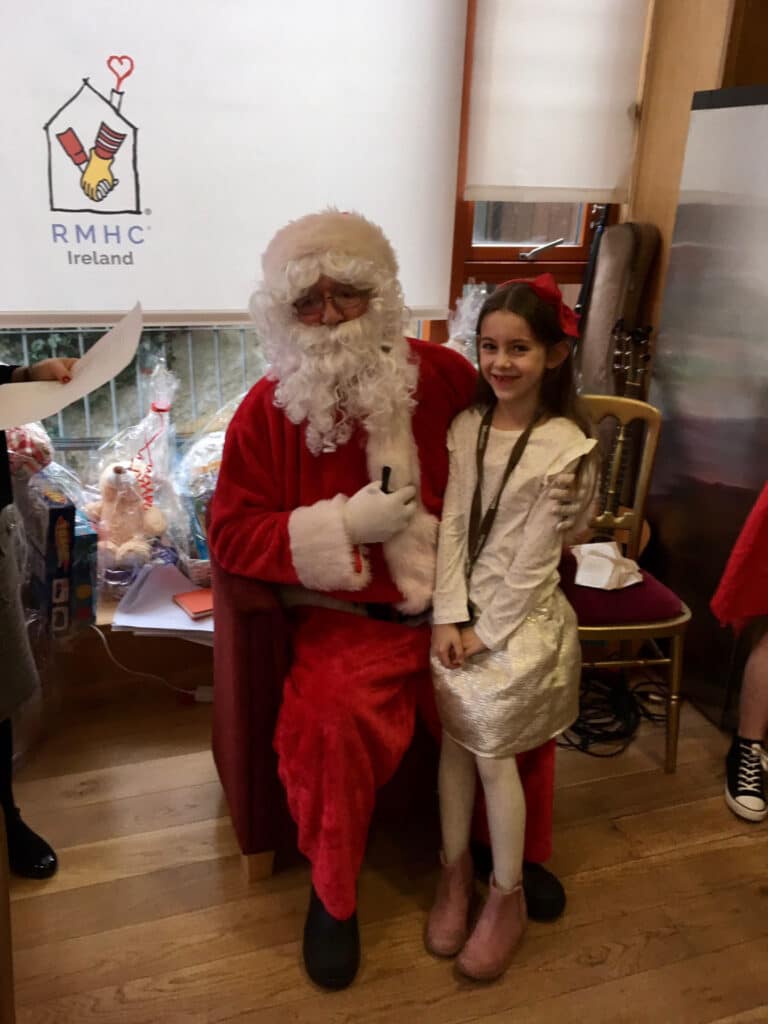 Little girl with Santa Clause